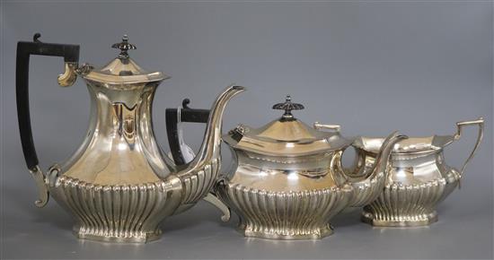 A three piece silver plated tea and coffee set, with half fluted bodies